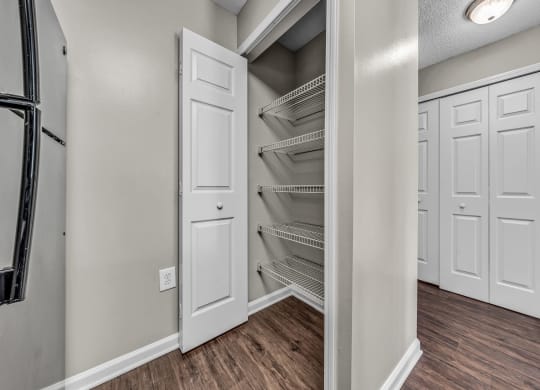 the closet in a new home with white closets and white doors at Trophy Club at Bellgrade, Midlothian, VA, 23113