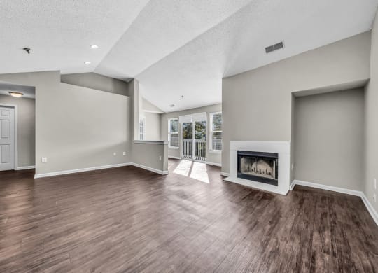 the living room has a fireplace and hardwood floors at Trophy Club at Bellgrade, Midlothian, VA, 23113