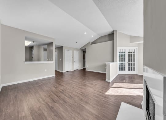 the living room and dining room of a new home with hardwood flooring at Trophy Club at Bellgrade, Midlothian, VA, 23113 