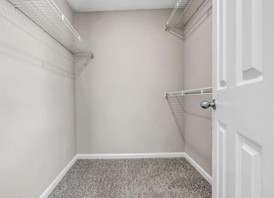 an empty closet in a home with a white door at Trophy Club at Bellgrade, Midlothian, VA, 23113
