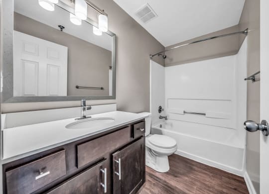 a bathroom with a sink and a toilet and a bath tub at Trophy Club at Bellgrade, Midlothian, VA, 23113