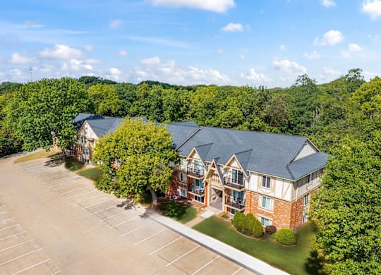 A large building with a parking lot in front of it at Timberlane Apartments, Illinois, 61615