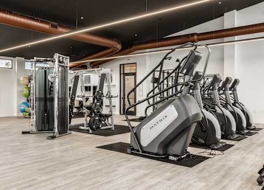 Gym with a variety of equipment including treadmills, weights, and exercise machines at Upper Vue Flats, Ohio