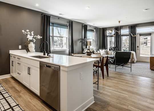 A modern kitchen with a large island and a dining area at Upper Vue Flats, Dublin
