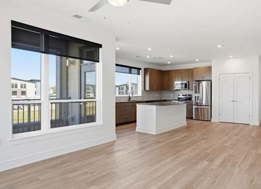 A spacious kitchen with wooden floors and white walls at Upper Vue Flats, Dublin