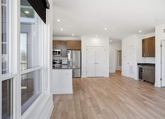 A modern kitchen with wooden floors and white walls at Upper Vue Flats, Dublin