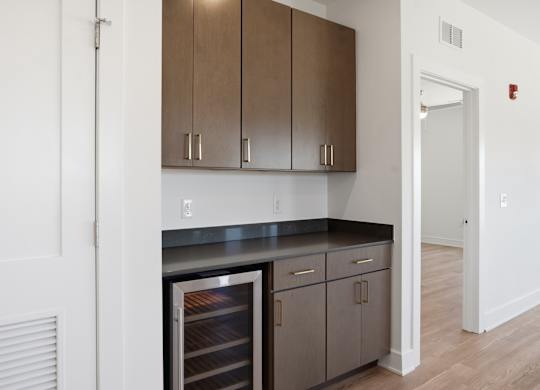 A kitchen with a refrigerator, cabinets, and a counter at Upper Vue Flats, Dublin