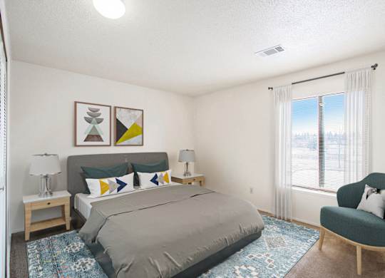 A spacious bedroom with a large bed, window and a chair at Walnut Trail Apartments, Portage, MI, 49002