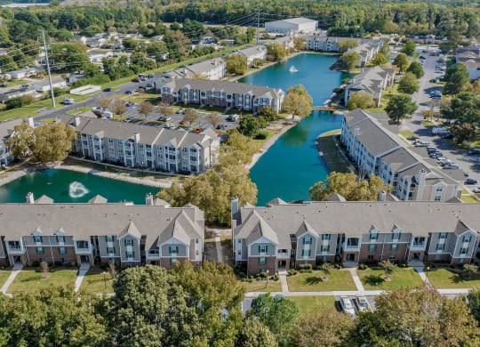 an aerial view of building and lake at WaterFront Apartments, Virginia