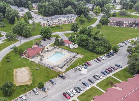 an aerial view of a swimming pool and volleyball court at West Wind Apartments, Fort Wayne