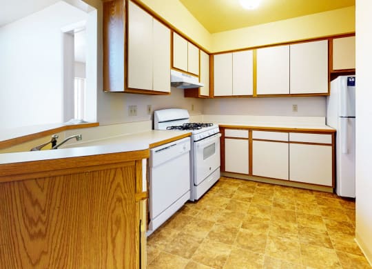 a kitchen with white appliances