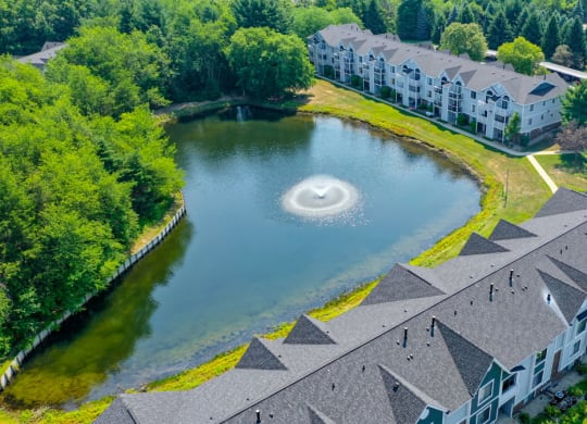 Aerial Pond with Fountain View at Windmill Lakes Apartment Homes in Holland, MI