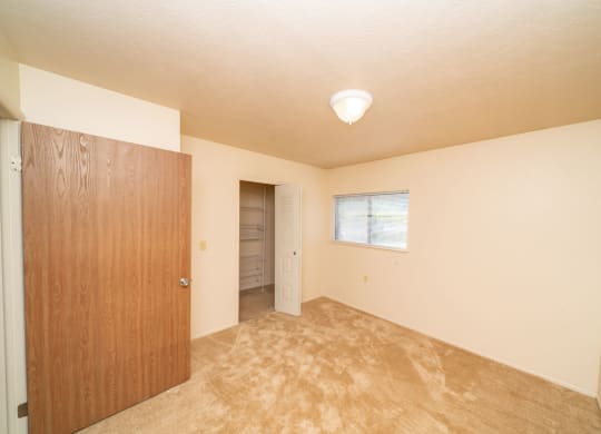 Spacious Bedroom with Windows and Large Closet at Windmill Lakes Apartments, Holland, 49424