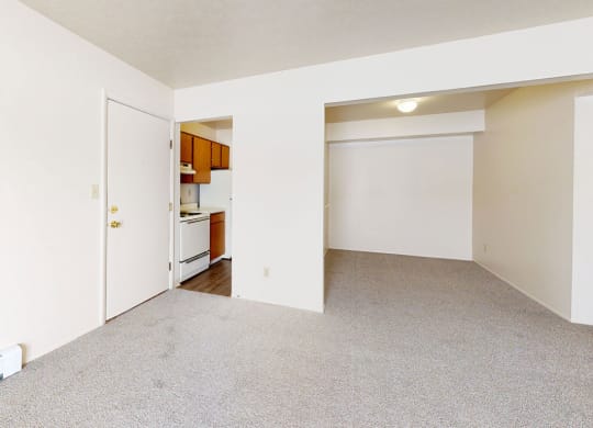 living and dining areas with plush carpeting  at Wood Creek Apartments, Kenosha, WI