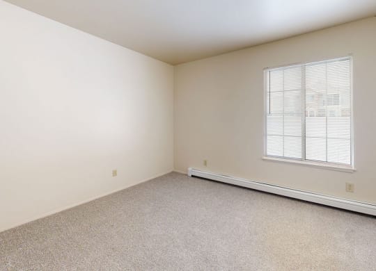 bedroom with a large window  at Wood Creek Apartments, Kenosha, WI, 53144