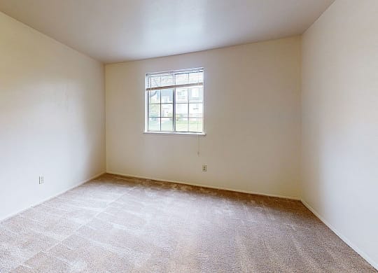 spacious bedroom with plush carpeting  at Wood Creek Apartments, Wisconsin