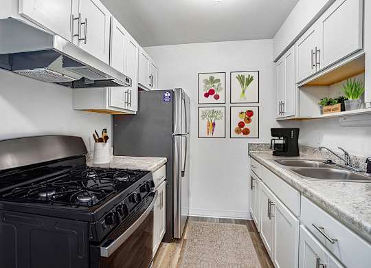 A kitchen with stainless steel appliances at Wood Creek Apartments, Kenosha, WI, 53144