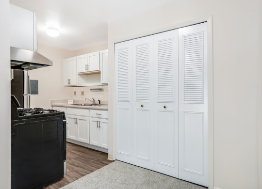 Kitchen with Stainless Steel Appliances Private Balcony at Wood Creek Apartments in Kenosha, WI