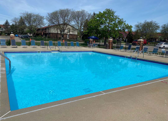Outdoor Pool with Large Sundeck at Wood Creek Apartments, Kenosha, WI