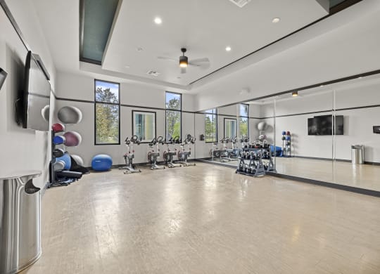 State-Of-The-Art Gym And Spin Studio with TV at Pearce at Pavilion Luxury Apartments, Riverview, FL, Florida