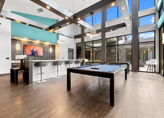 a game room with a pool table and a bar at Pearce at Pavilion Luxury Apartments, Riverview, 33578