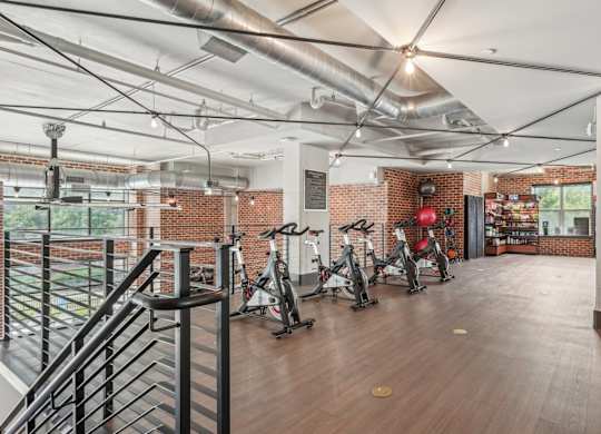 A gym with exercise bikes and convenient store.