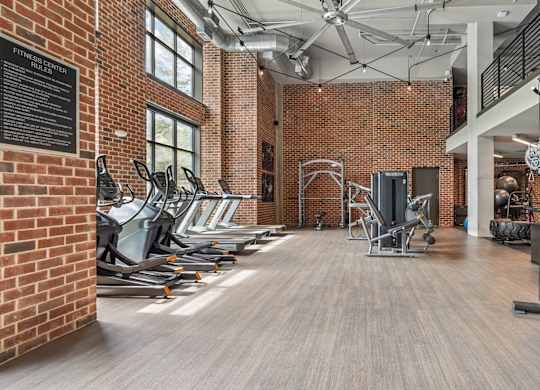A gym with cardio and resistance machines with many other equipment