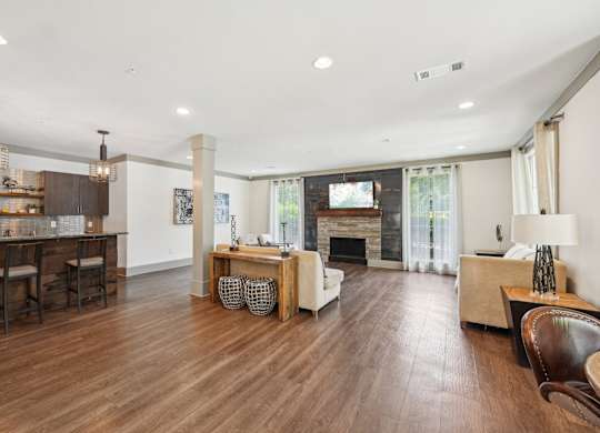 resident clubhouse with TV, seating, and kitchen