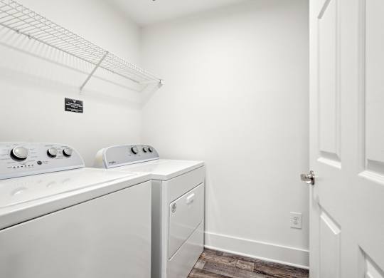 A laundry room with a washer and dryer.