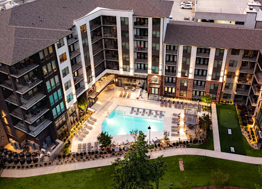 A large building with a pool in the middle of it.