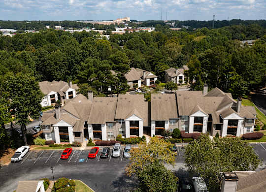 aerial view of apartment homes  with parking in front of it