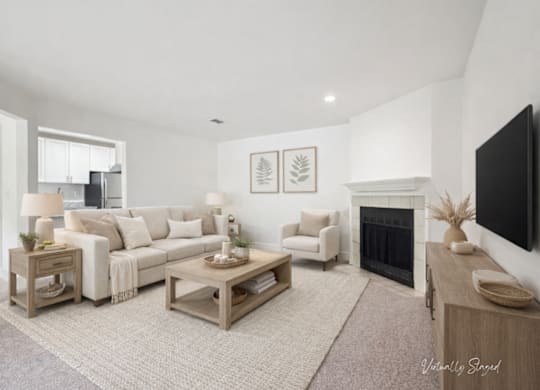 A living room with a fireplace and a couch.