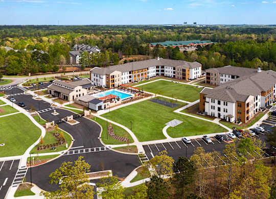 aerial view of station 75 apartments with the pool and buildings in view