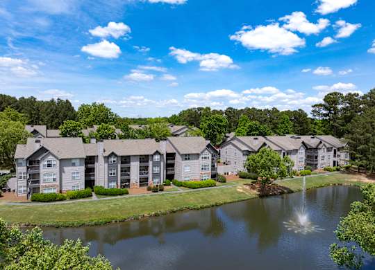 Wesley Place apartment buildings with a pond view