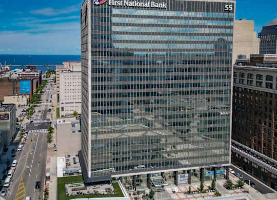 A First National Bank building is seen from a distance.