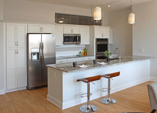Kitchen Island With Pendent Lights at Residences at Halle, Ohio