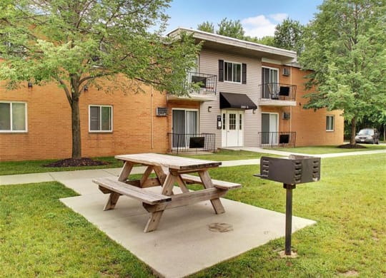 Picnic Area with Tables and Charcoal Grills at Lakeland Terrace