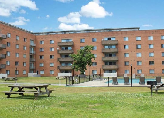 Sparkling Outdoor Swimming Pool and Picnic Area at Oliver House Apartments in Shaker Heights, OH