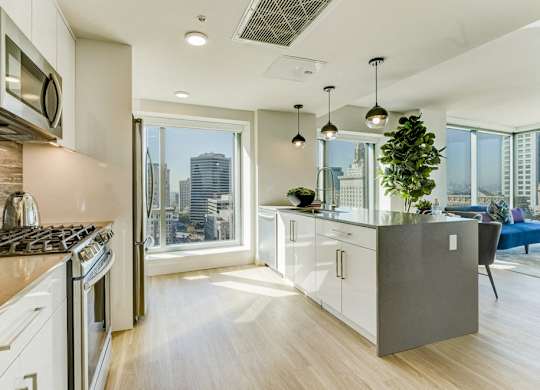 A modern kitchen with a view of the city.