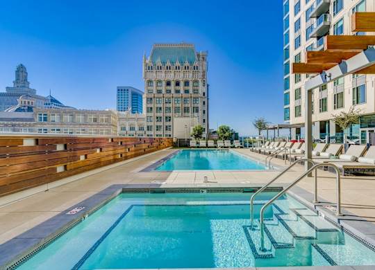 A large swimming pool with steps leading into it.