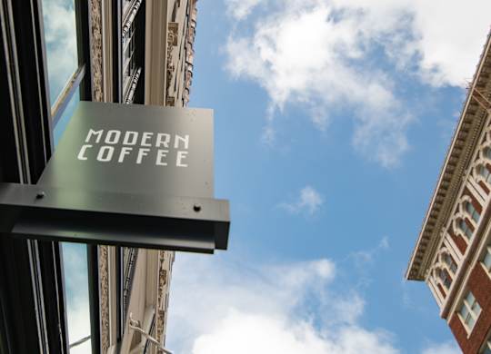 A sign that says Modern Coffee