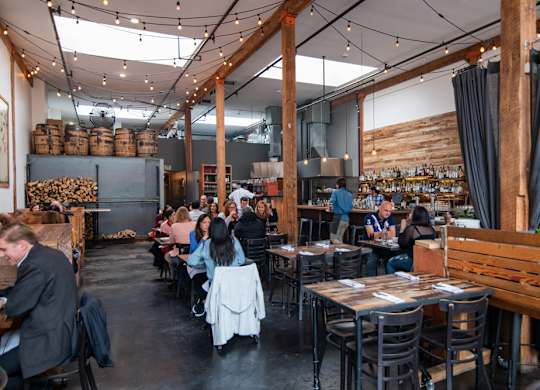 People sitting at tables in a restaurant
