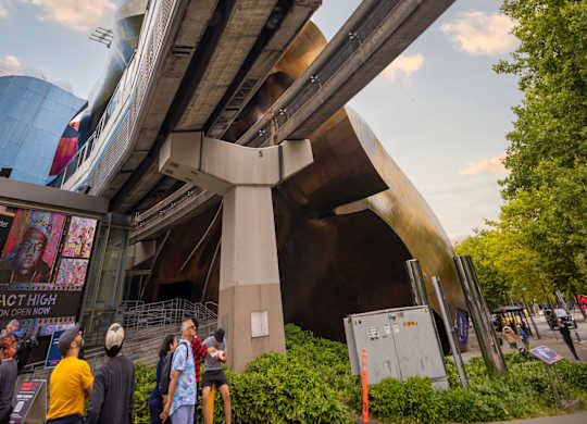 Elevated monorail track with modern station structure at Axis Seattle Apartments, Seattle, Washington