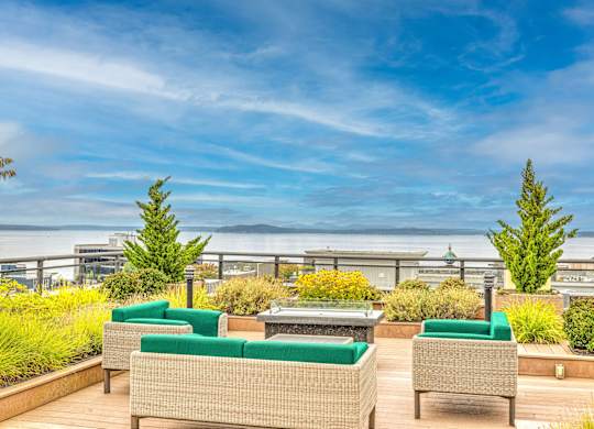 Rooftop terrace with seating and water view at Axis Seattle Apartments, Seattle, Washington