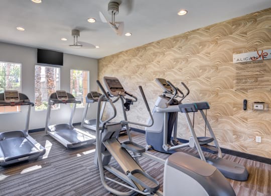 Spring Valley, NV Apartments - Alicante - Fitness Center with Treadmills, Elliptical Machines, and Large Windows