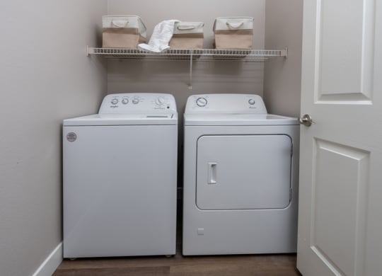 a washer and dryer in a laundry room with a door