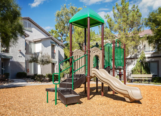 our apartments have a playground with a slide and playset