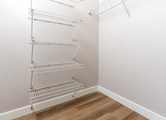 our spacious closets are equipped with a spacious walk in closet with metal shelves
