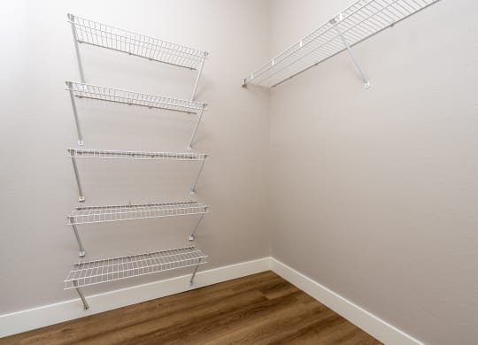 our spacious closets are equipped with a spacious walk in closet with metal shelves