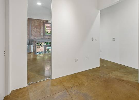 A room with white walls and a tiled floor.